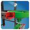 Marble run with green funnel and steel ball entering from the top. Structural elements in red and black against a blue background.