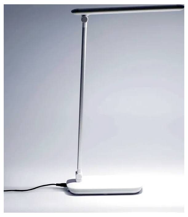 A sleek, modern desk lamp with a slim base and adjustable arm, emitting a bright, even light.