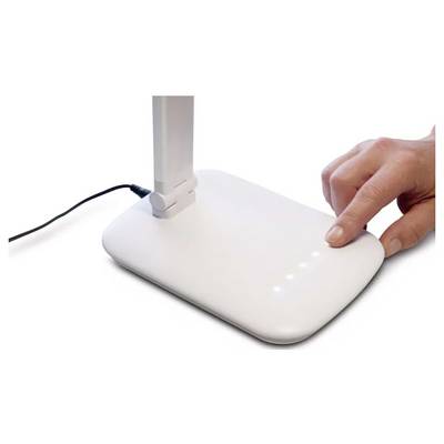 A hand touches a white device with LED indicators, possibly a power button, on a modern, minimalist design, connected by a cord.