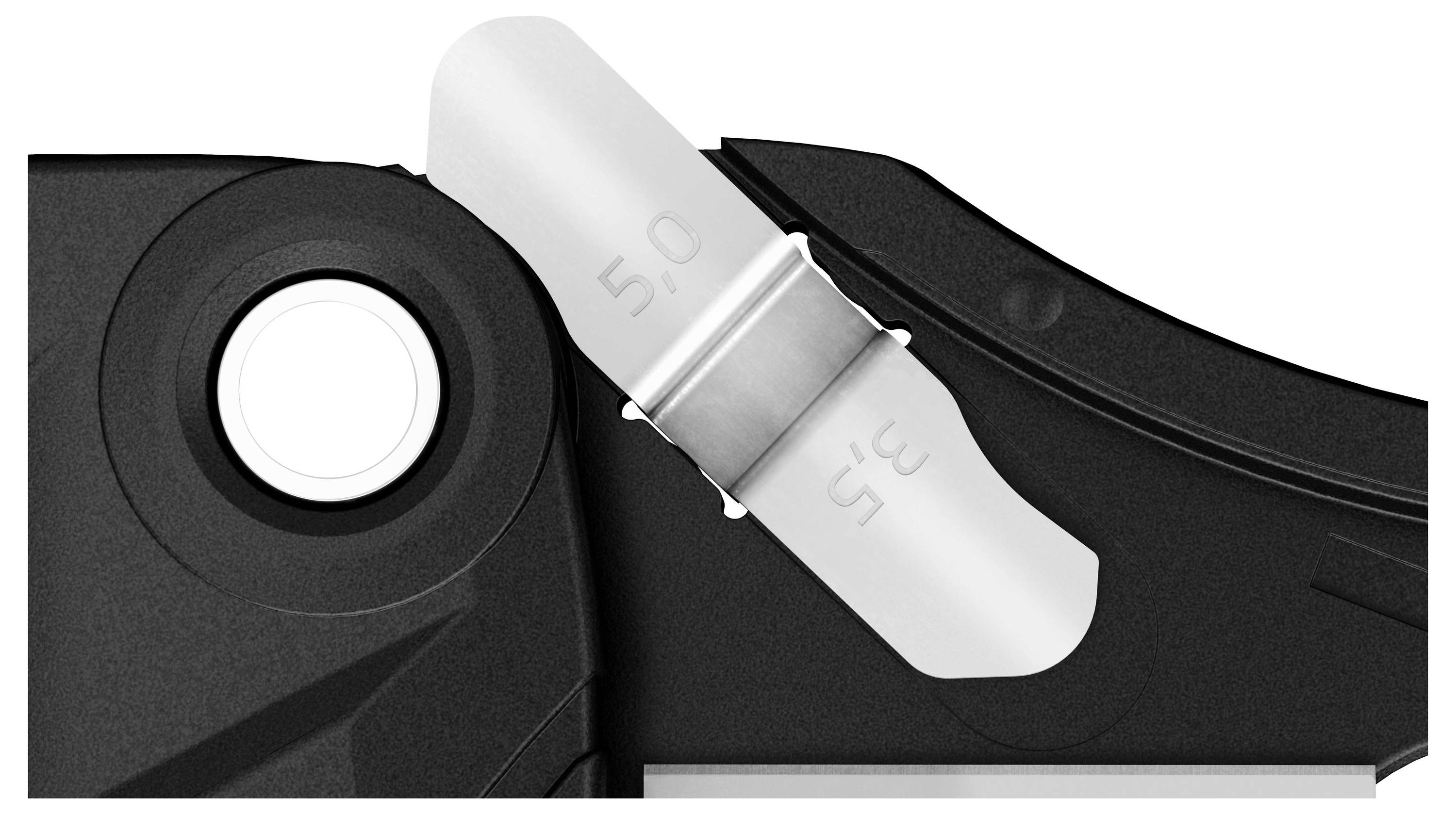 Close-up of a torque wrench with clear indication of 5.0 and 3.5 settings on a white, scaled background.