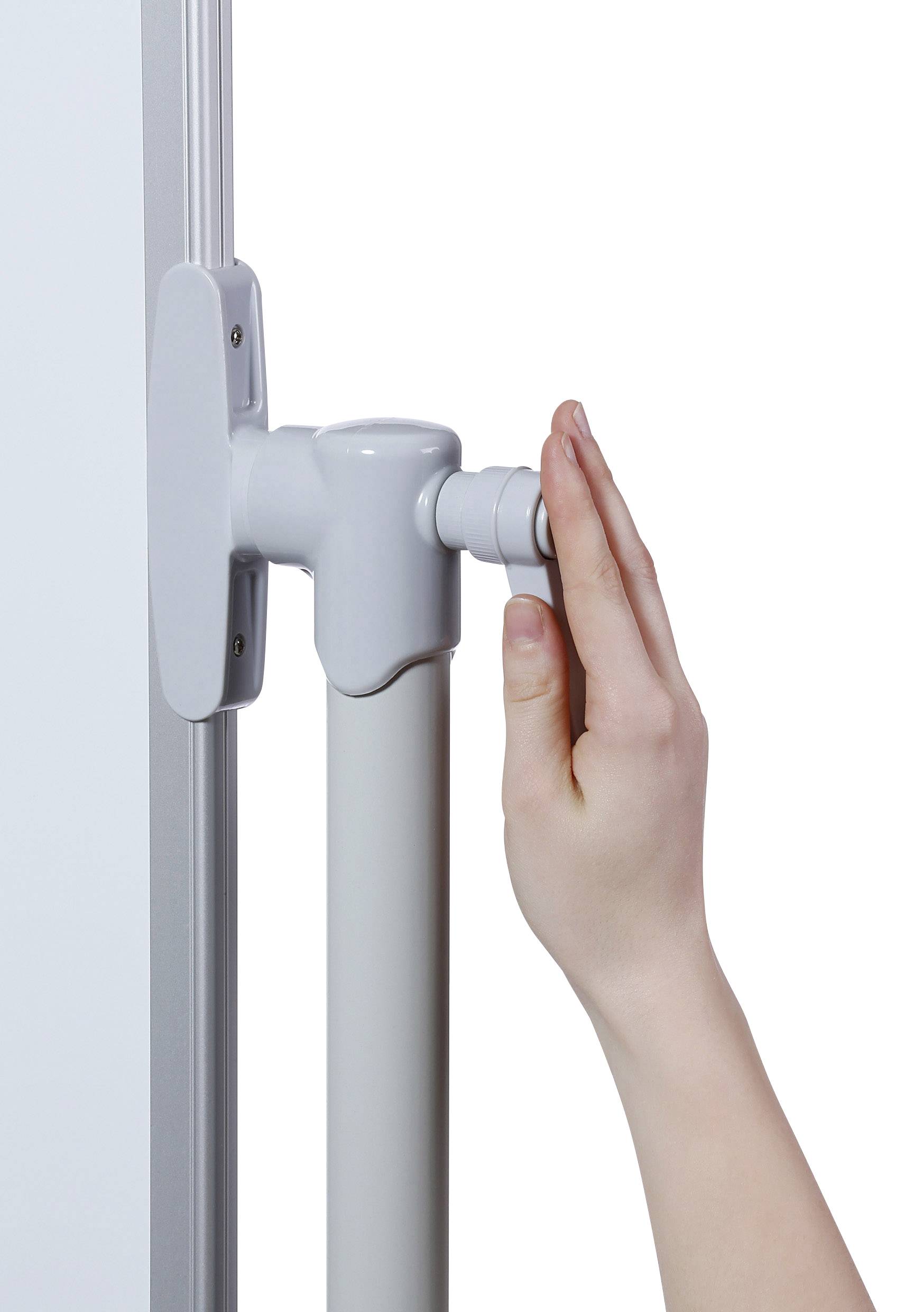 A hand turns a mechanism on an adjustable-height table to change the position of the tabletop.