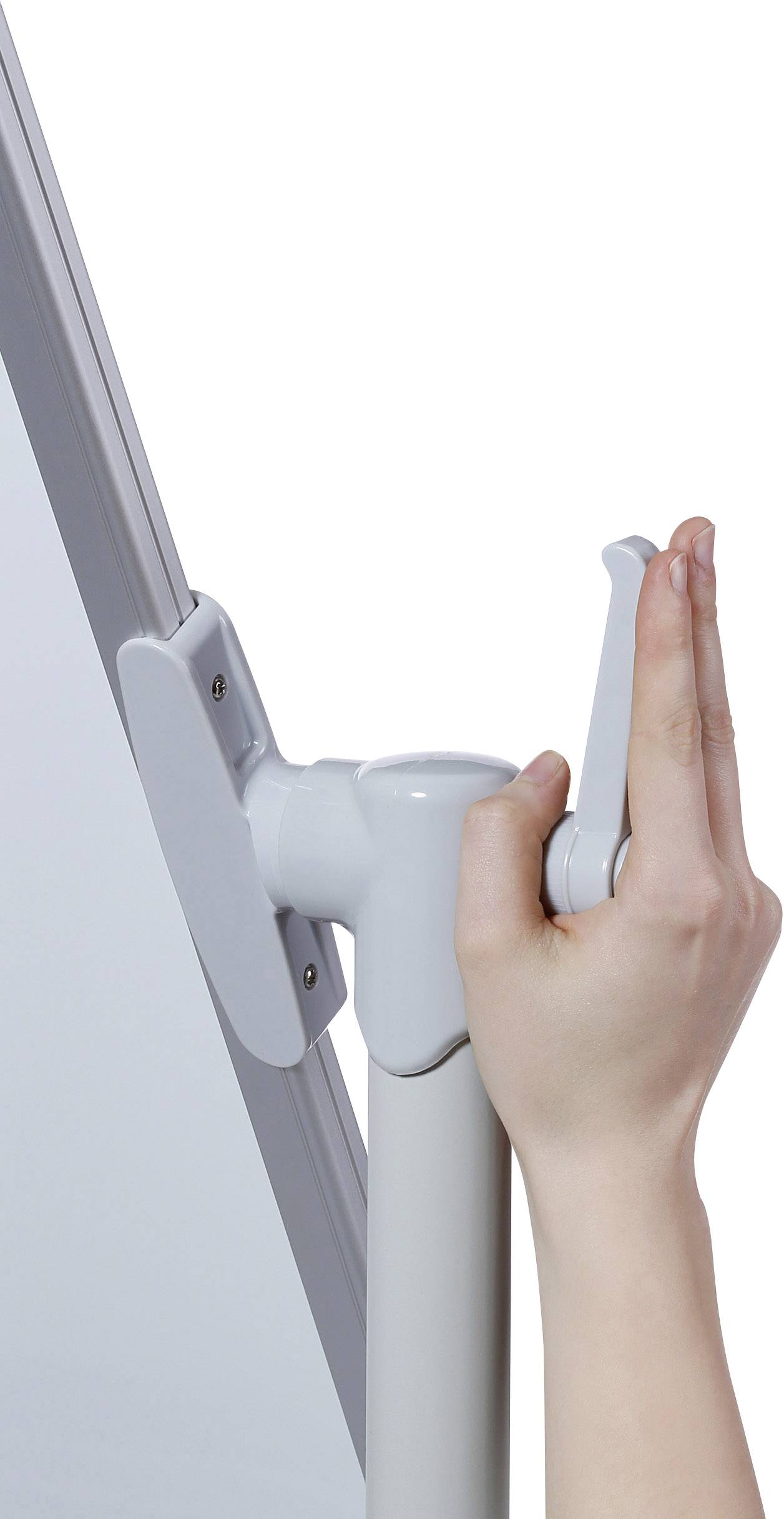 A hand is holding a lever attached to a rotating mechanism of a white board.