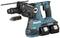 A blue-green cordless hammer drill with two batteries. Brand: Makita. It features an interchangeable drill chuck and is suitable for heavy-duty work.