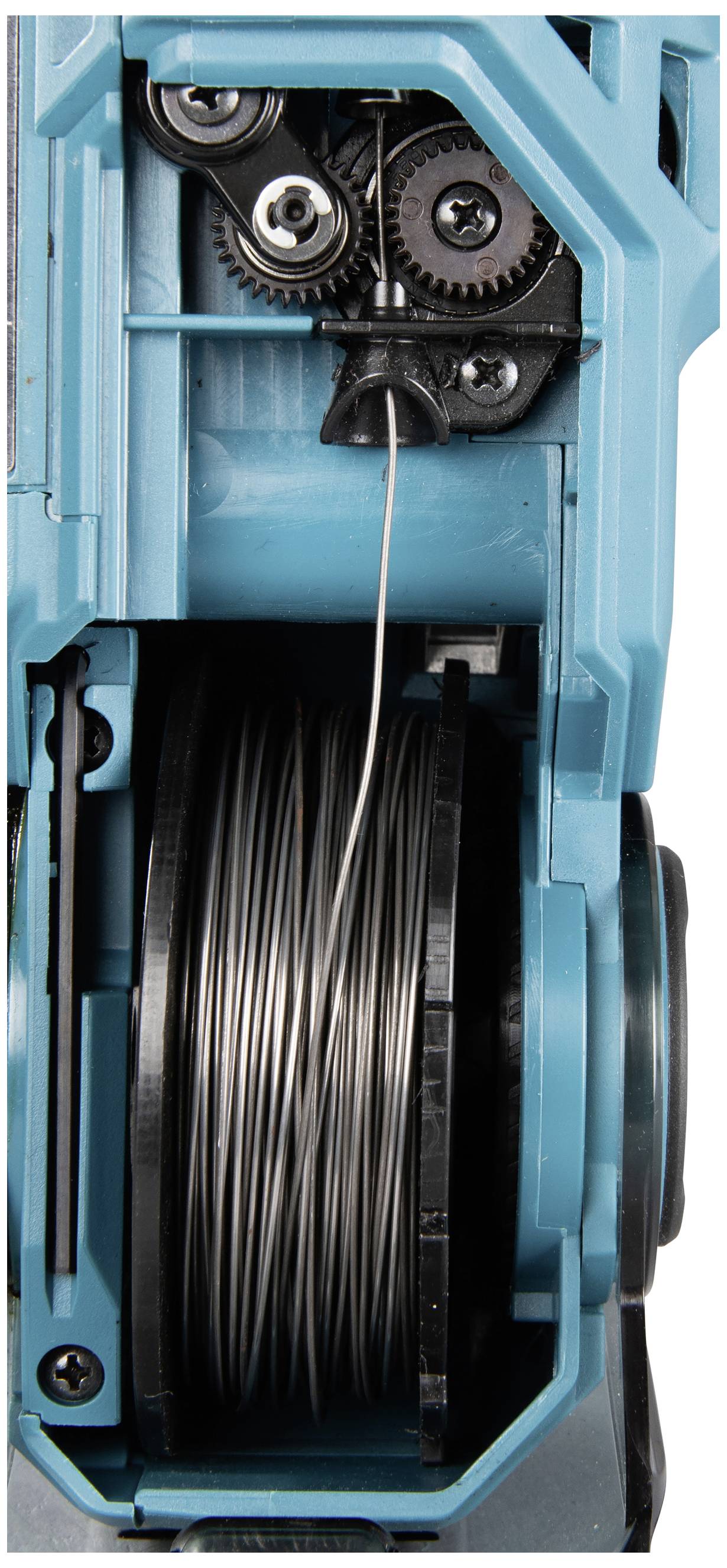 A close-up of an electrical tool revealing gears and a coiled wire spool inside.