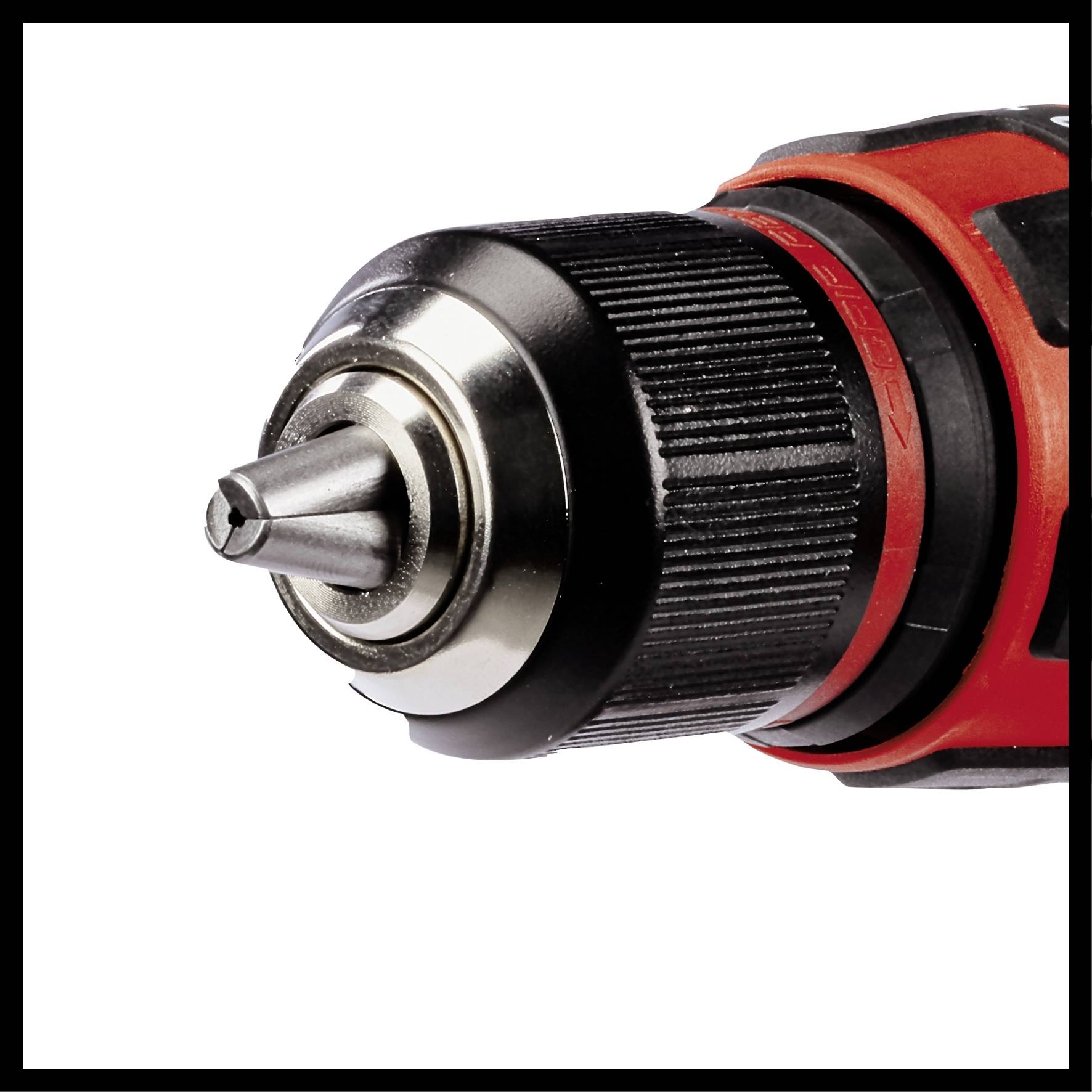 Battery drill chuck with silver metal drill bit and red housing, close-up. Suitable for drilling work.