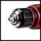 Battery drill chuck with silver metal drill bit and red housing, close-up. Suitable for drilling work.