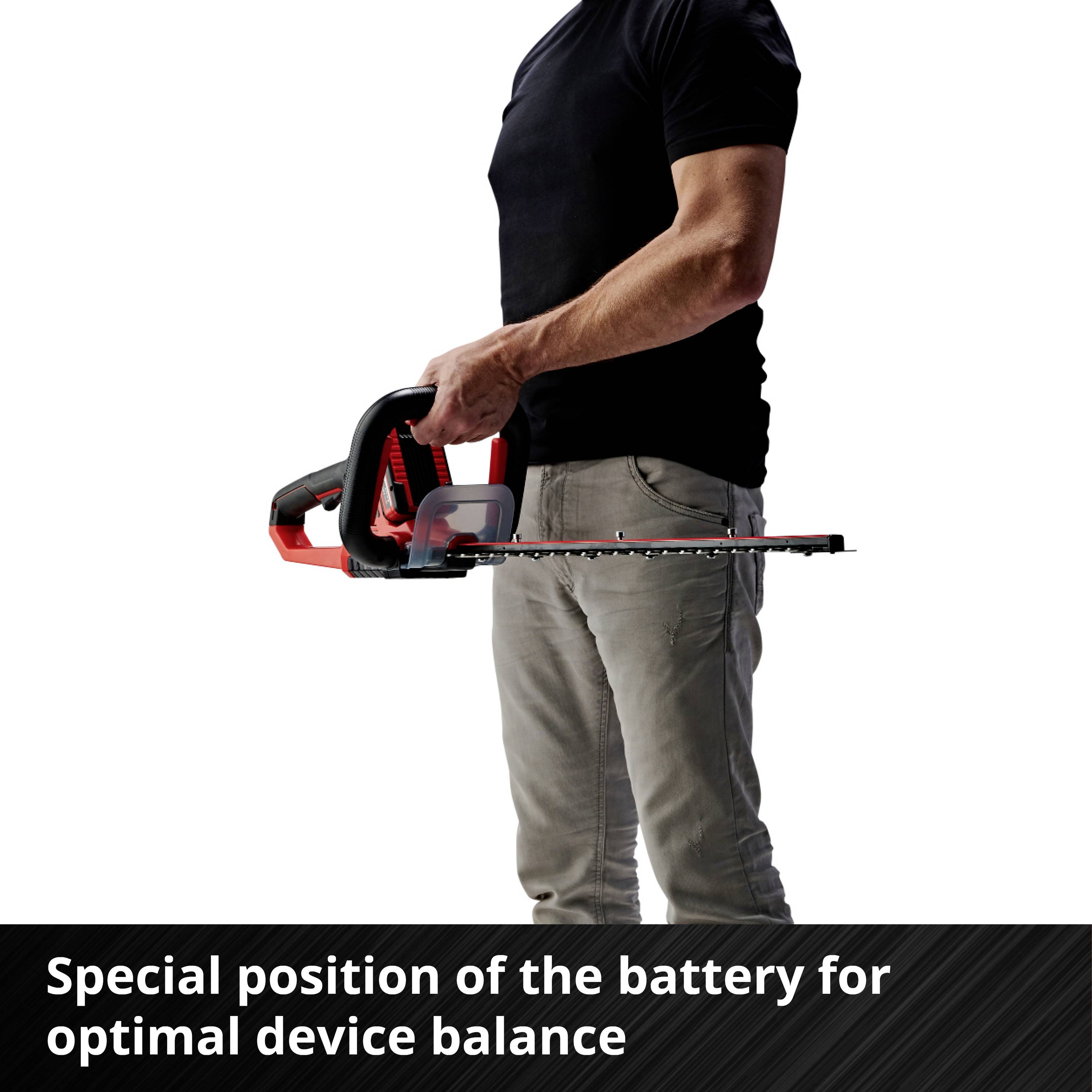 Man holding hedge trimmer with red handle; Text in image: 'Special battery position for optimal device balance'.