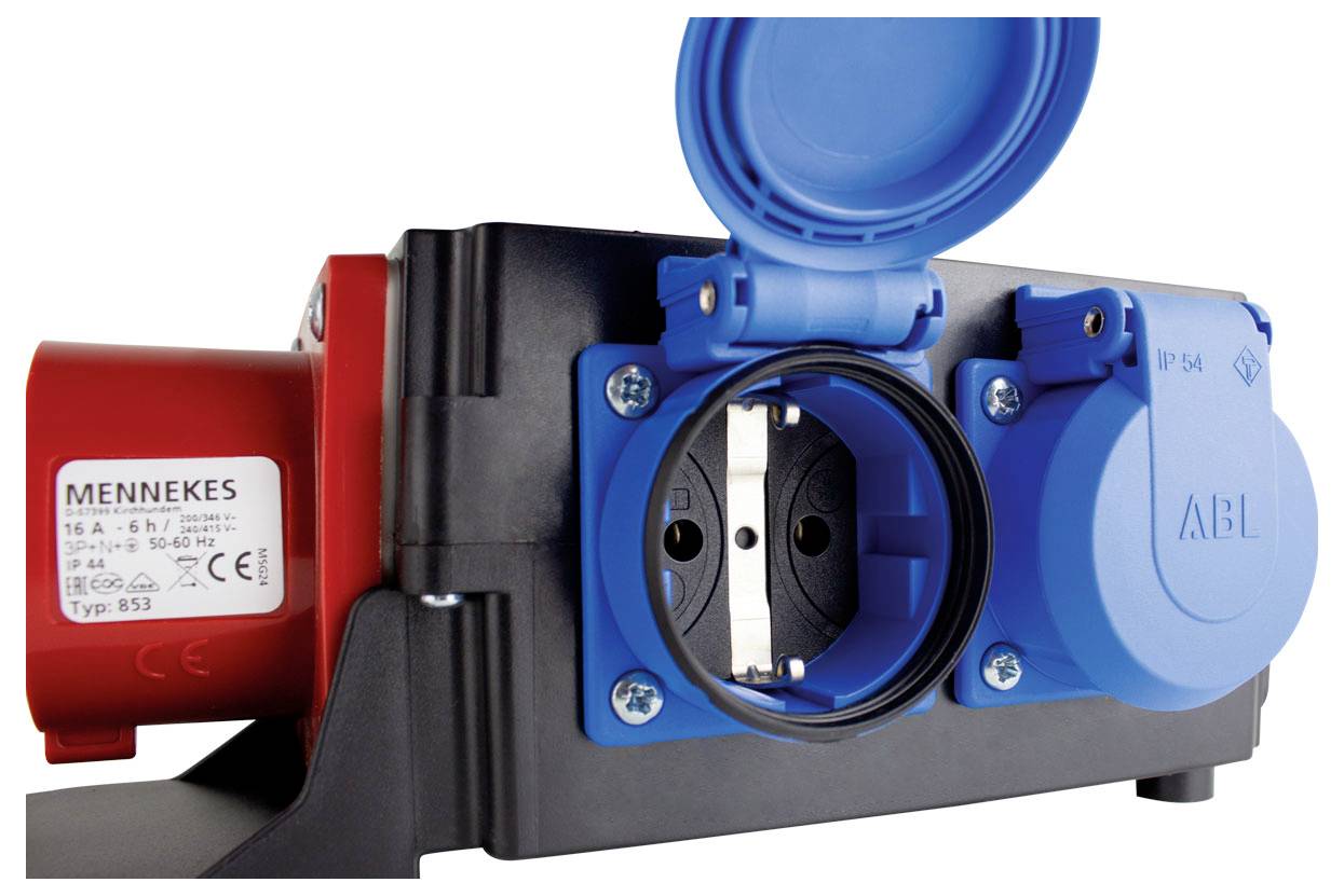 A close-up of a power socket outlet with red and blue plugs, showing different voltage specifications and a closed cover on one socket.