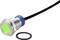 Metallic LED push switch with green illuminated ring and cable, shown with black seal.