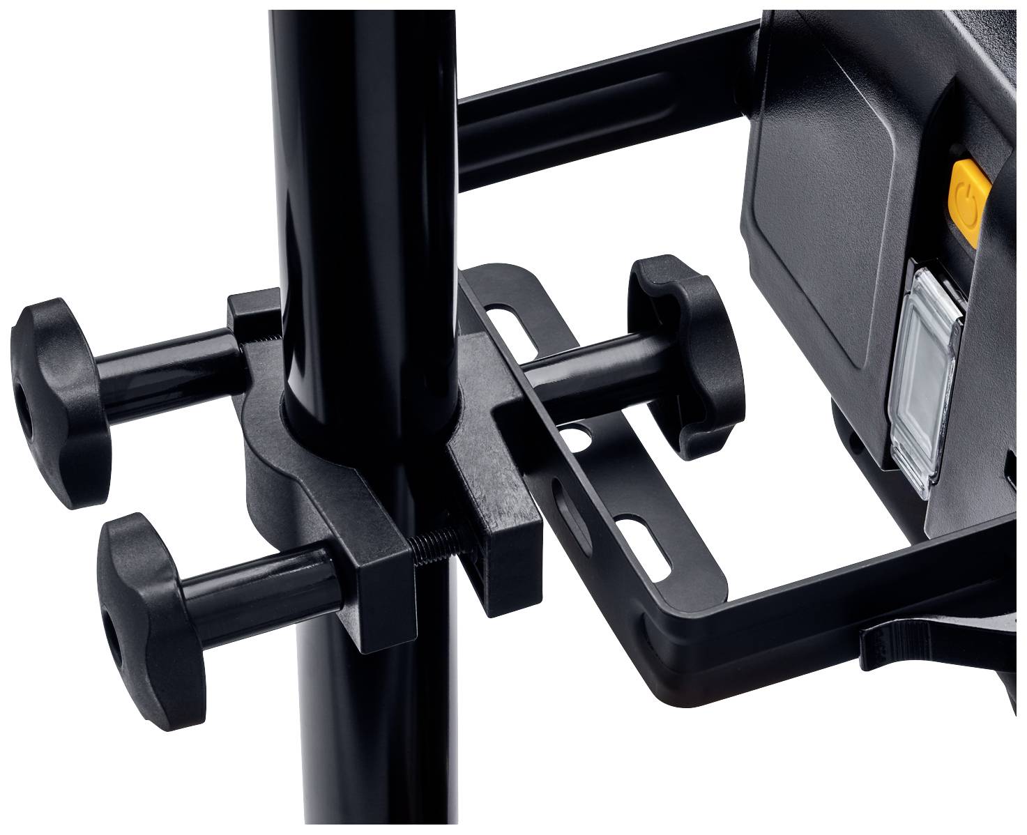 Close-up of a black clamp with a screw mechanism for attaching to a pipe. On the right: a custom-fitted device.