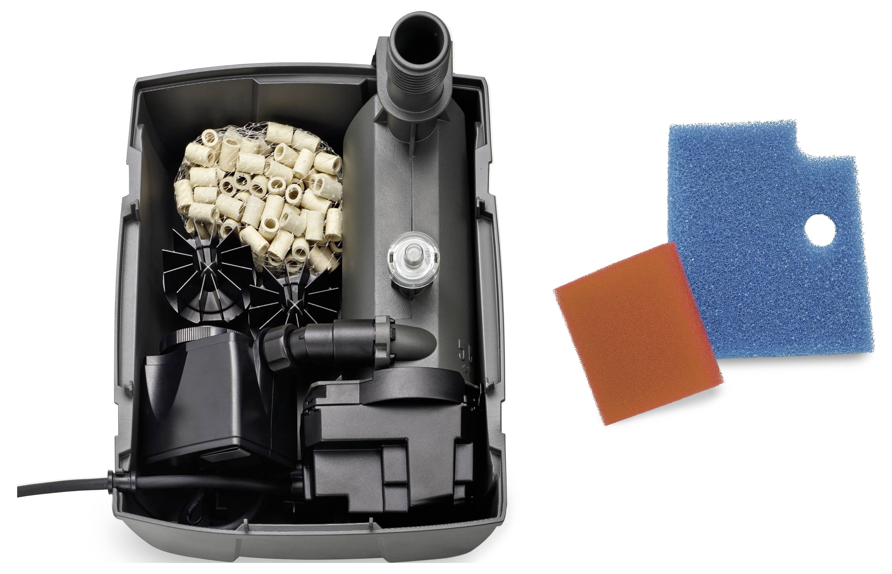 'Open aquarium filter with various filter media, including ceramic rings, bio-balls, and mechanical components; two filter sponges beside.'