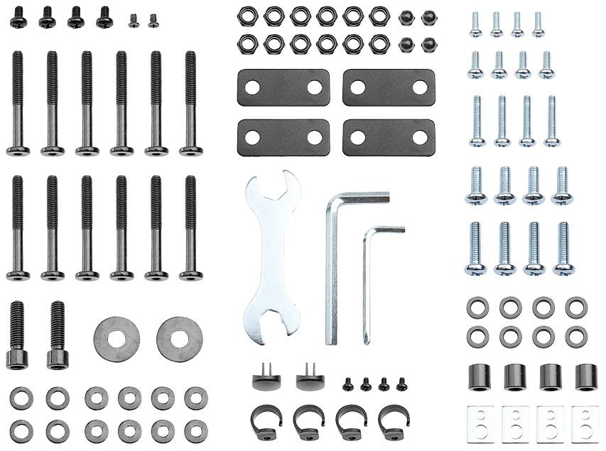 Various metal fasteners such as screws, nuts, washers, a spanner and Allen keys on a white background. Ideal for assembly or repair work.