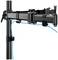 Monitor mount with cable management. Two arms with clamps for cable attachment, mounted on a vertical pole.