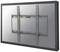 A black rectangular metal TV wall mount, installed on a reflective glass surface.