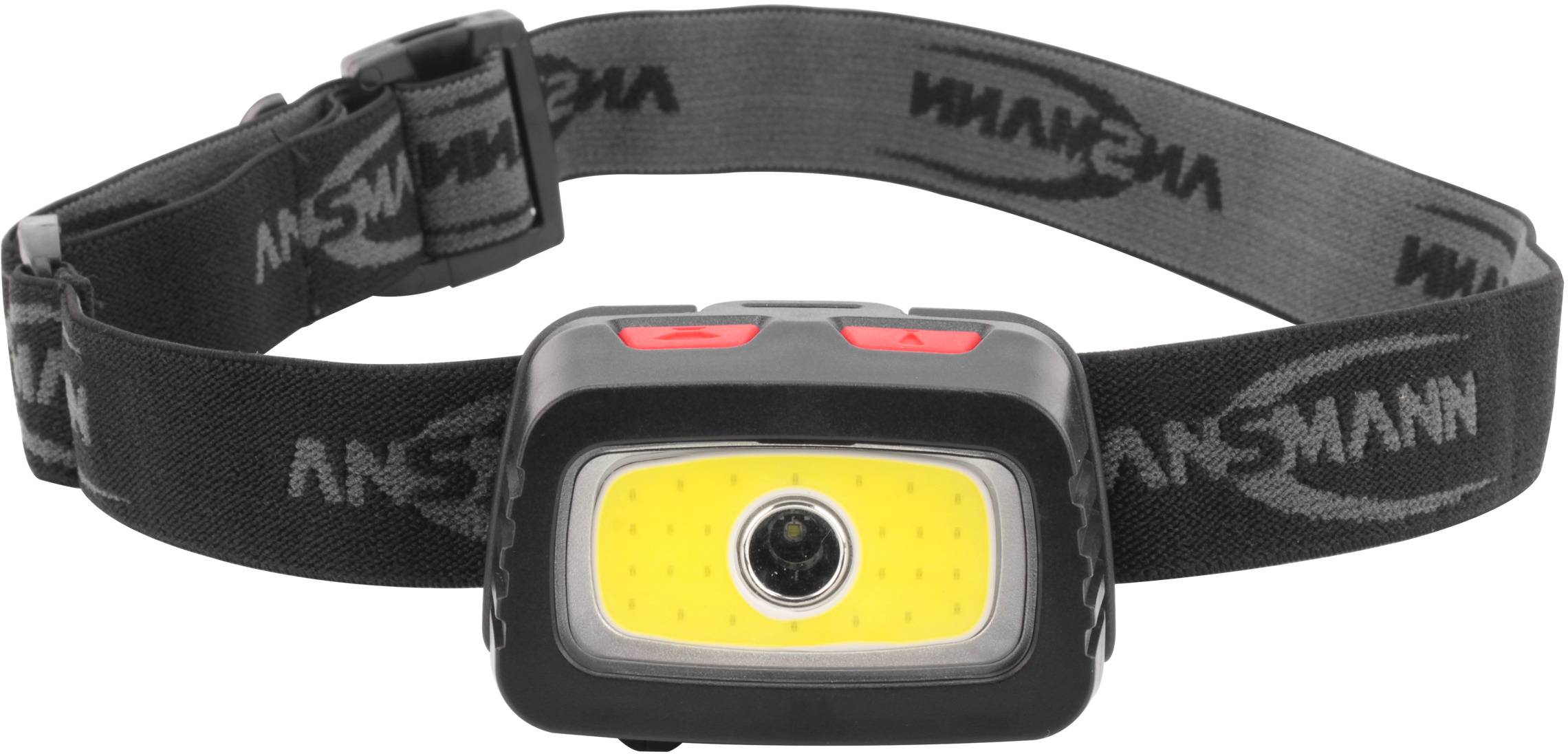 Head torch with a black strap, two red buttons at the top and a central LED light source.