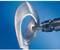'A drill grinds a rough metal edge against a blue background.'