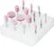Various pink grinding tools with metal attachments are arranged on a white foam block.