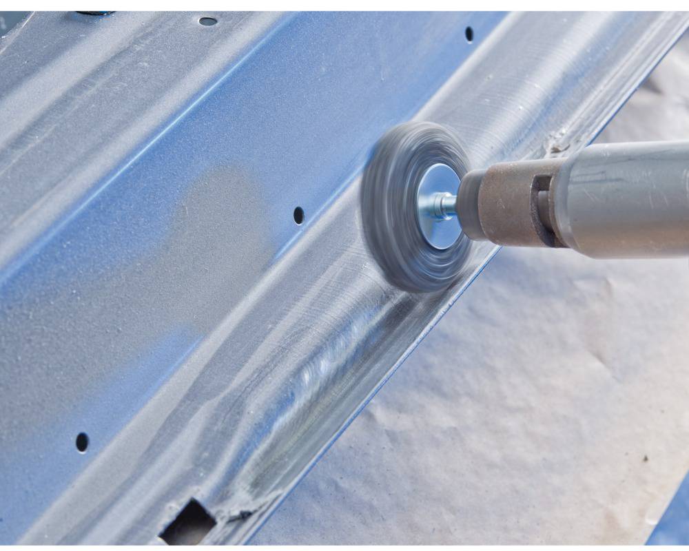 'Grinding machine polishes a metal surface'