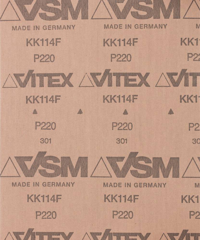 A sheet of sandpaper with the inscription 'VSM', 'Made in Germany', 'KK114F', 'P220'. It displays the grit size and manufacturer's brand.