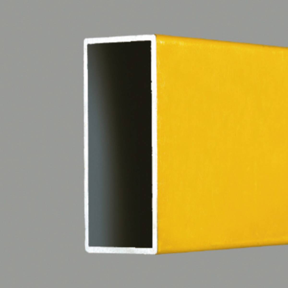 A rectangular, yellow, hollow tubular piece with a black interior, open on the right side, against a grey background.