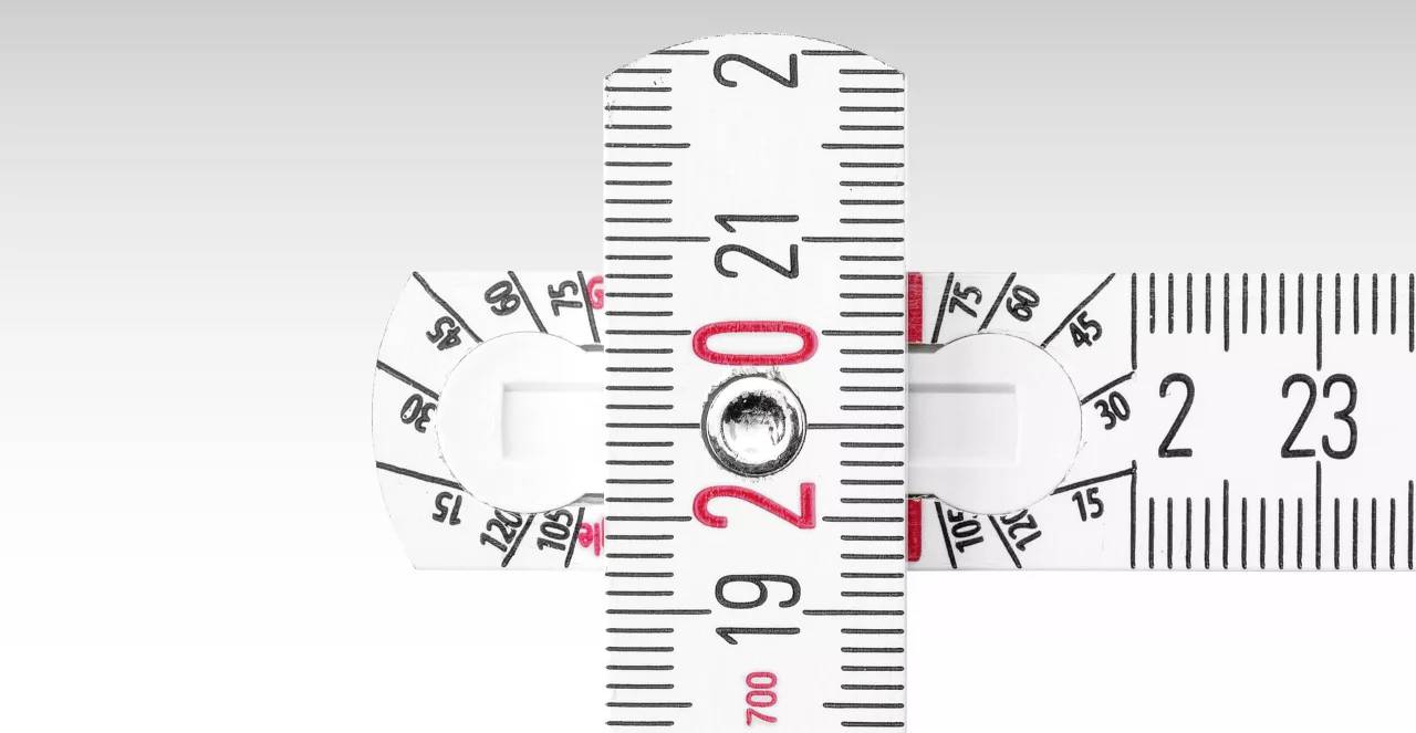 Two tape measures cross at the 20 mark, which is highlighted in red on a white background.