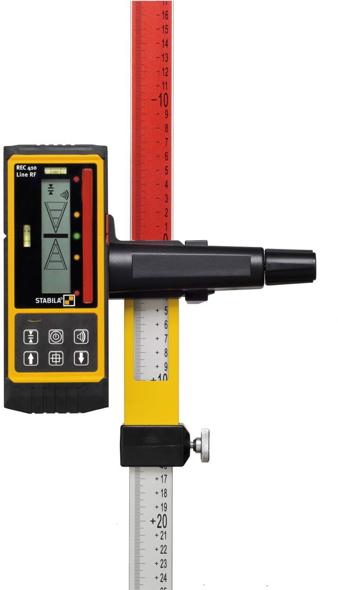 A laser detector on a measuring rod displays readings on a digital display. The markings on the measuring rod are visible.