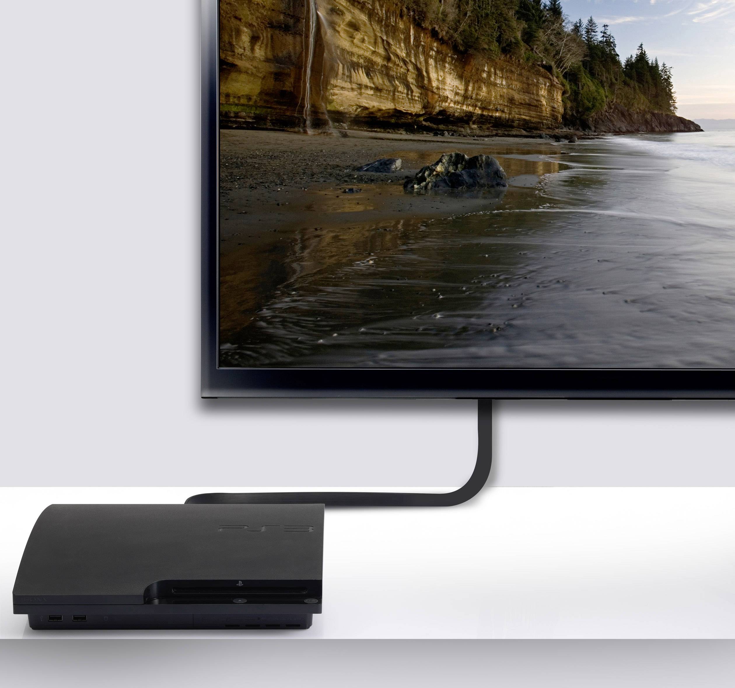 A television displays a coastal landscape with cliffs and water in the background. A console is depicted on the table beneath the television.