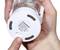 Close-up of a hand touching the base of a white device with the inscription 'Product Parameters', the switch is set to 'ON'.