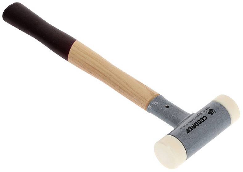 Rubber mallet with a wooden handle, grey metal head, and white plastic covering on the ends, set against a white background.