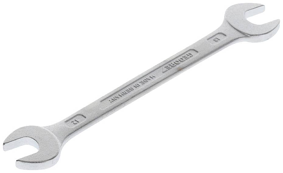 A silver-coloured double-ended spanner with size markings of 12 and 13, lies on a white background.