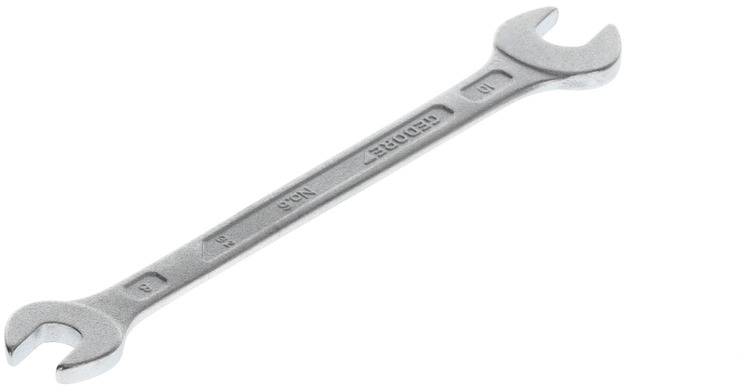A silver-coloured adjustable spanner with two differently sized ends lies on a white background.