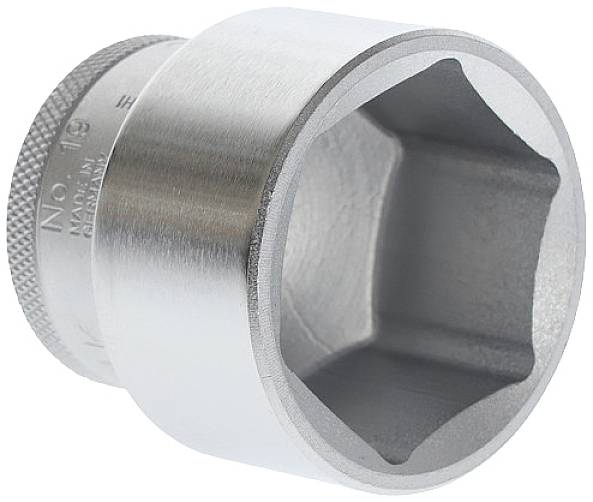 A large metal adjustable spanner with a hexagonal opening and a knurled handle is visible.