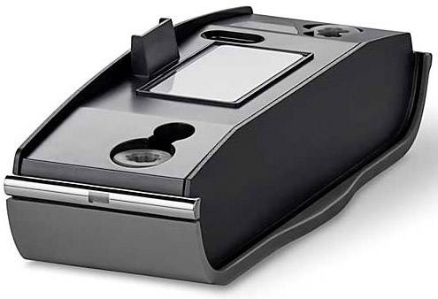 A black, rectangular ink cartridge holder with multiple recesses and a glossy top surface, lying on a white background.