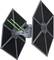 A spacecraft with two large, hexagonal side wings and two green laser beams being fired from the front.