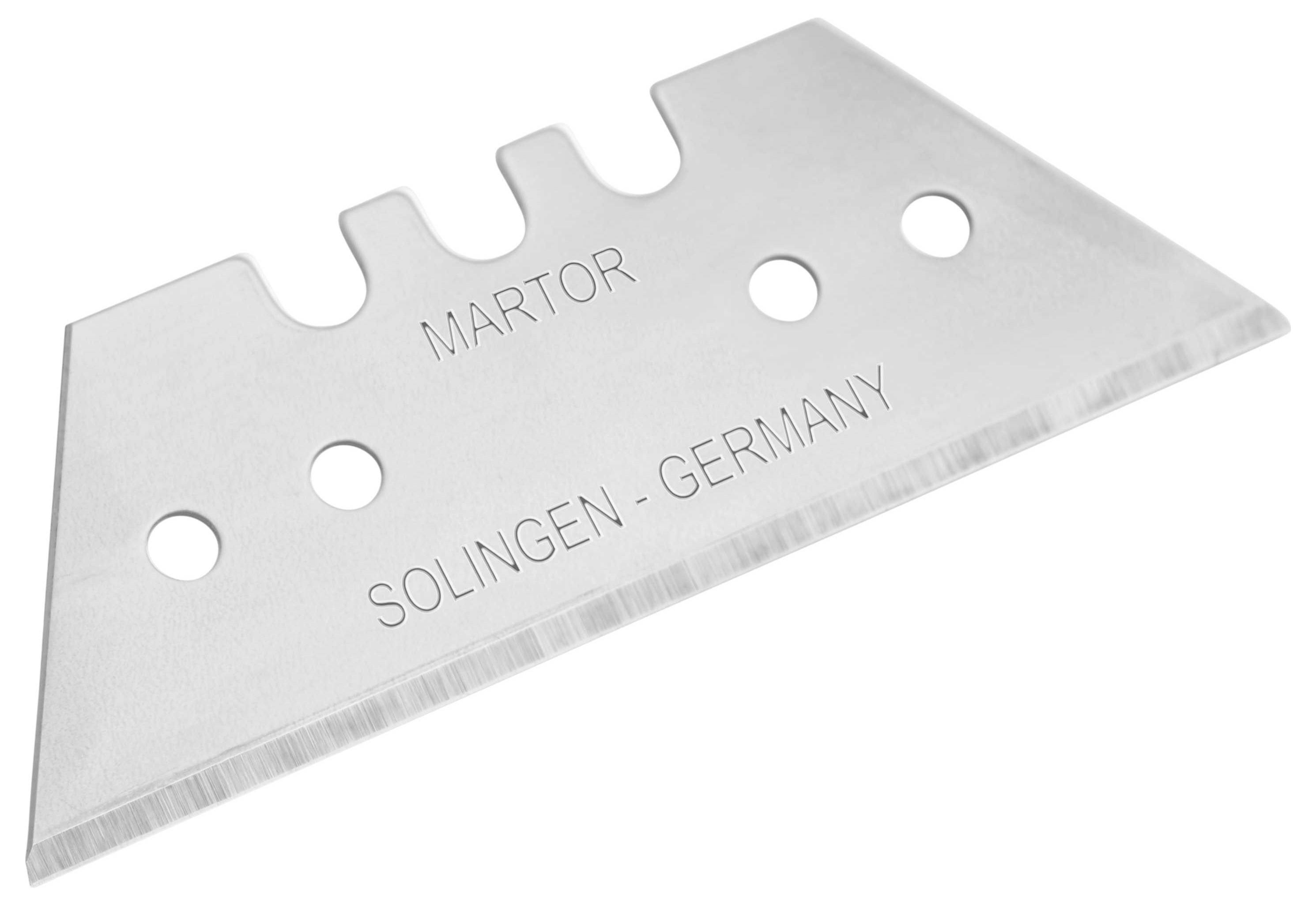 A silver razor blade knife with the inscription 'Martor Solingen - Germany' and three round holes.