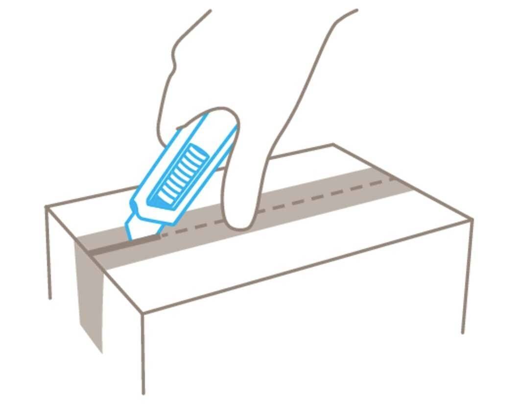 'Image of a hand using a craft knife to open a cardboard box along a dotted line.'