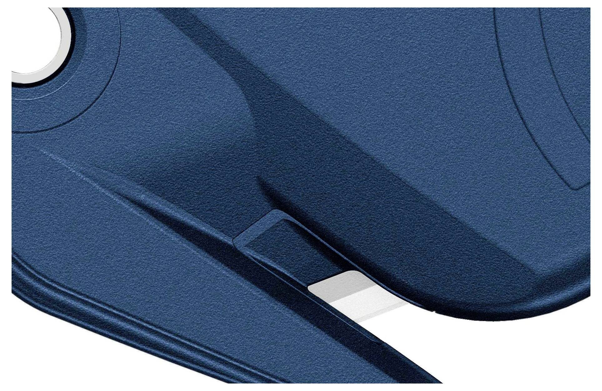 A blue, structured object with curves and edges, possibly part of a housing or cover, is depicted.