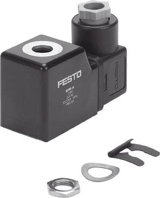 A black electrical component from the Festo brand with connections and loose metal parts nearby, likely for machine assembly.