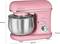 A pink stand mixer with a stainless steel bowl. Dimensions: 320 mm high, 350 mm wide, 210 mm deep. Power output: 1100W.