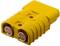 Yellow plug with two metal sockets, used for electrical connections.