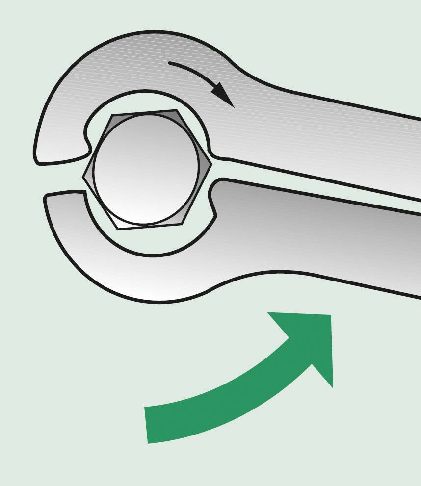The image shows a spanner positioned on a hexagonal nut. A green arrow indicates the direction of rotation.