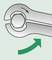 The image shows a spanner positioned on a hexagonal nut. A green arrow indicates the direction of rotation.