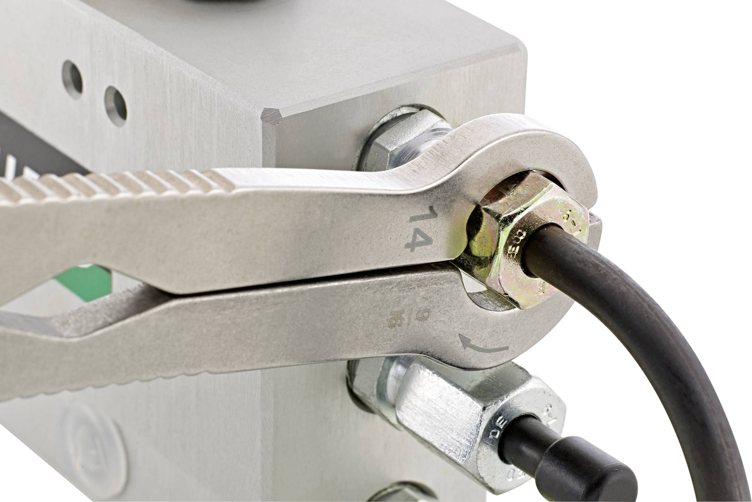 Close-up of a spanner tightening a nut. A cable connection is attached to the nut, indicating a technical application.