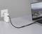 A laptop is plugged into a power socket. A harbour is displayed on the screen.