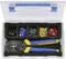 Open toolbox with a crimping plier and various coloured cable lugs in separate compartments.