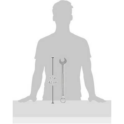 Silhouette of a person standing behind a table. A stillson wrench lies on the table, 42 cm long.