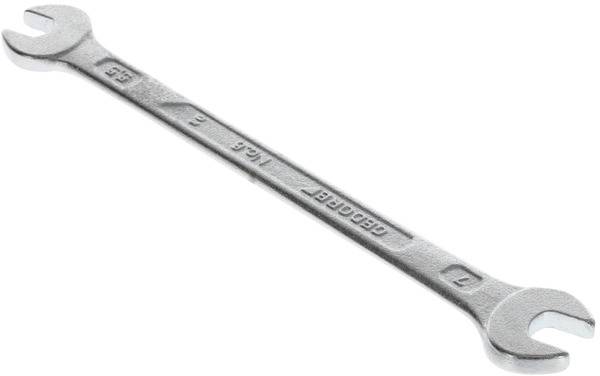 An adjustable spanner with an open-ended design, lying on a white background, suitable for various bolt and nut sizes.