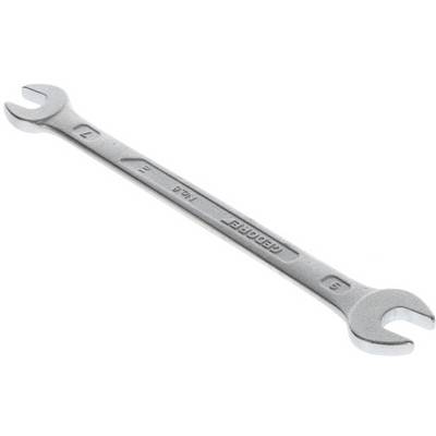 A silver double-ended spanner with size markings 9 and 7, lies diagonally on a white surface.