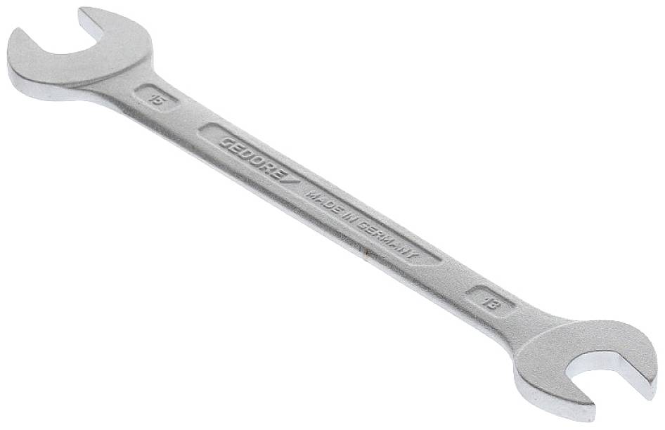 A silver-coloured spanner with '13' and '15' sizes at the ends. Inscription 'Gedore Made in Germany'.