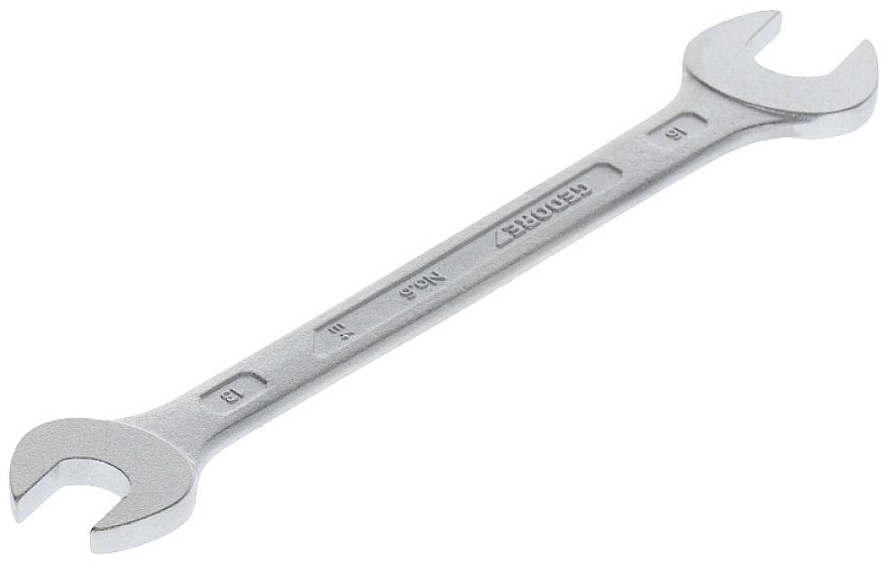 A silver spanner with two open ends of different sizes is lying on a white background.